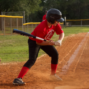 A Flagler Babe Ruth Baseball player, sponsored in part by Anchor Electric of Florida